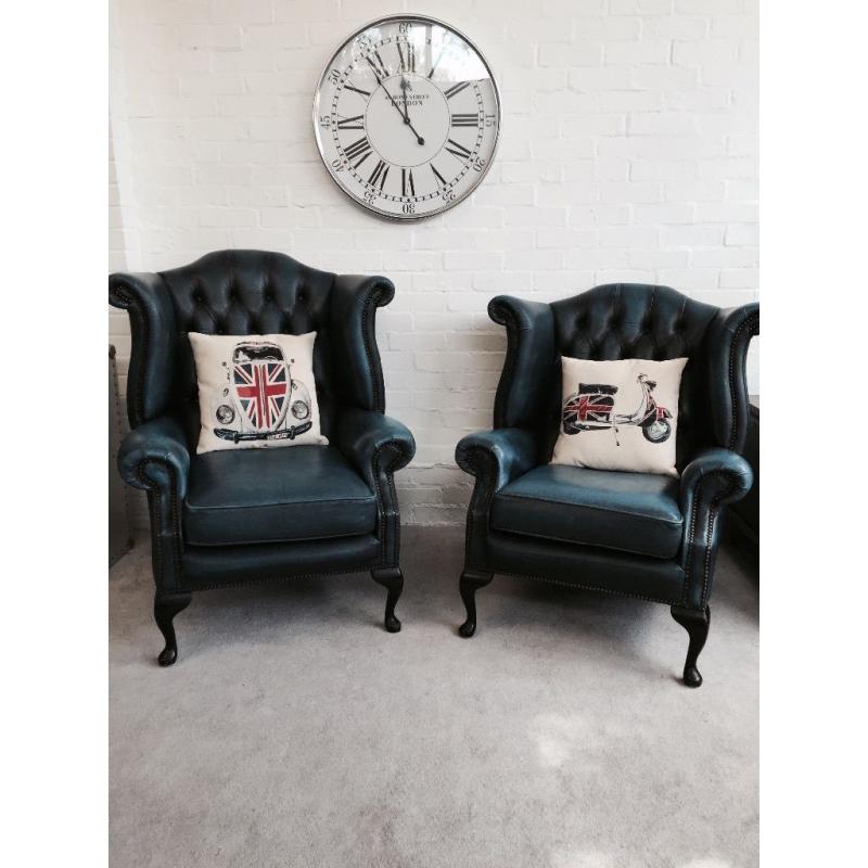 Beautiful blue leather Chesterfield Queen Anne wingback armchairs. Can deliver