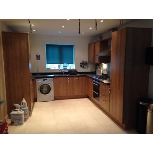 Fitted kitchen units worktops hob sink and tap