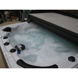Crystal Cove 6-seat hot tub with lid and starter kit.