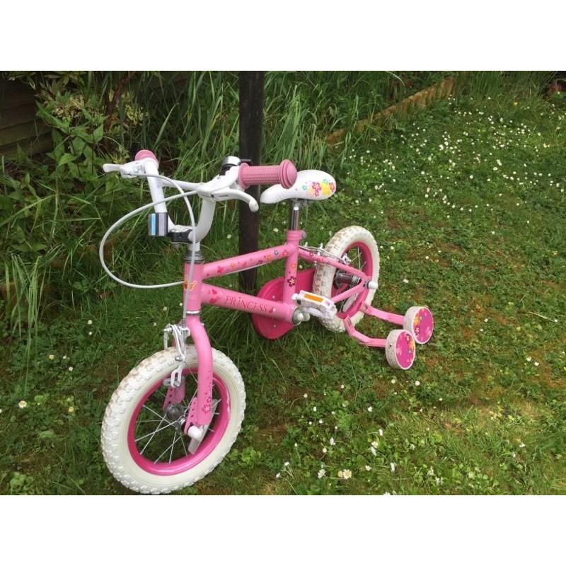 Pink girls bike with stabilisers