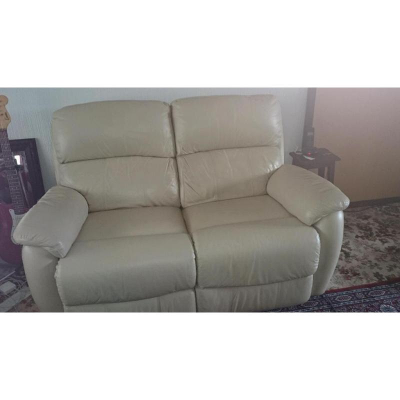 Two leather settees sofas one is a twin electric recliner