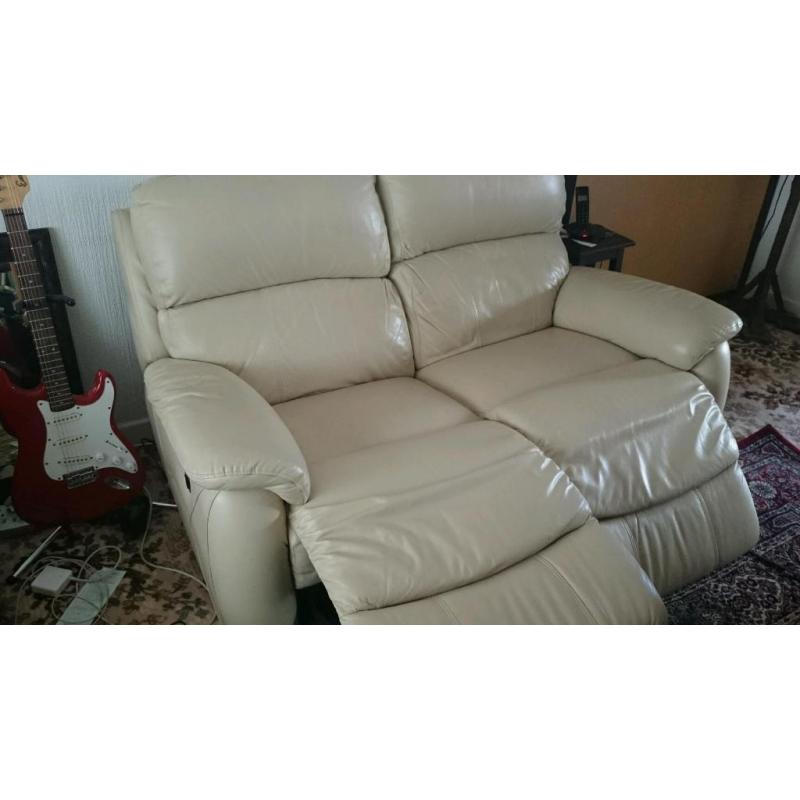 Two leather settees sofas one is a twin electric recliner