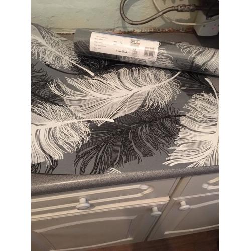 Grey, black and white feather wallpaper