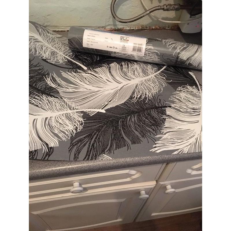 Grey, black and white feather wallpaper