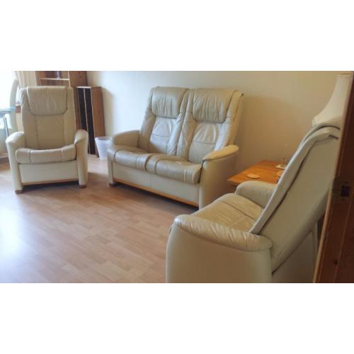 Scandinavian leather suite with reclining seats and 2 storage footstools
