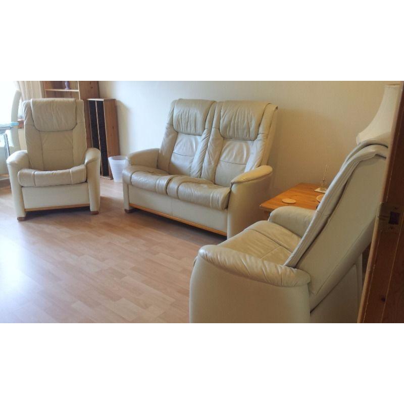 Scandinavian leather suite with reclining seats and 2 storage footstools