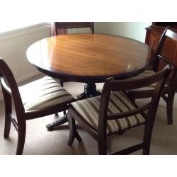 Mahogany finish dining suite: Circular table, 4 chairs, sideboard, bookcase/ cabinet, bureau.