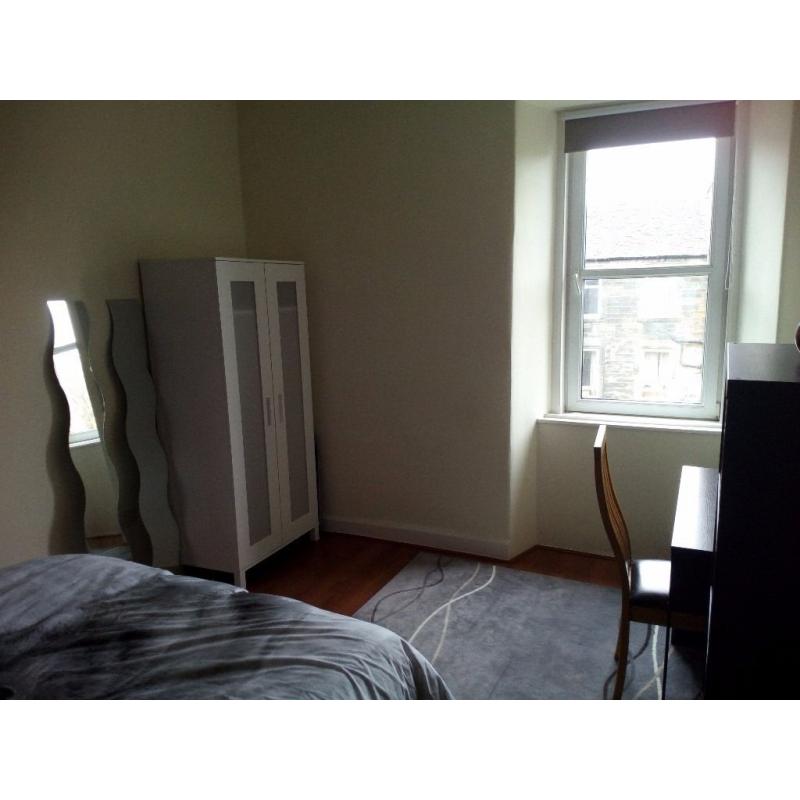 Spacious double bedroom in freshly renovated flat during festive period
