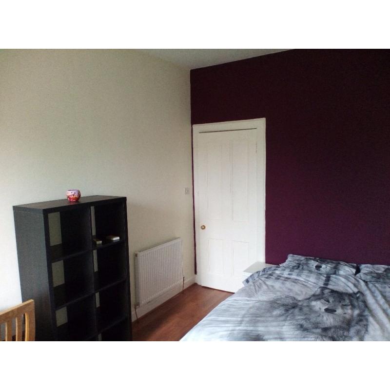 Spacious double bedroom in freshly renovated flat during festive period