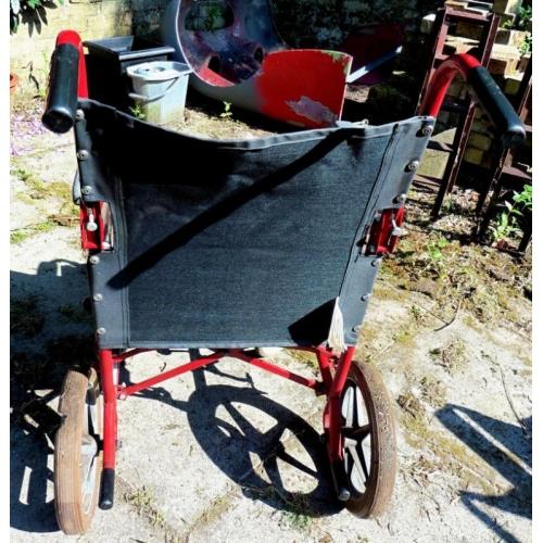 Wheelchair - folds, but not lightweight design. Needs attention, but serviceable.