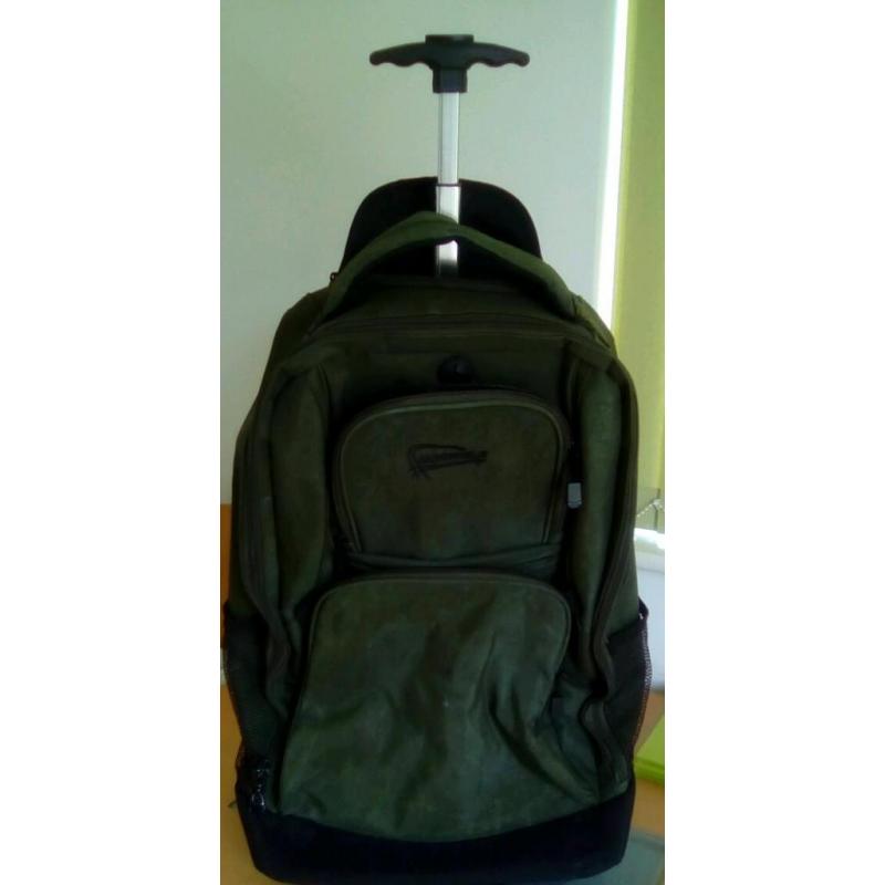 Green and black on wheels going away case