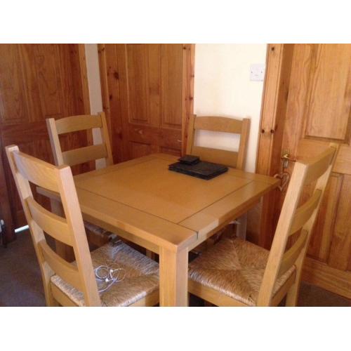 4 seater wooden dining table and chairs