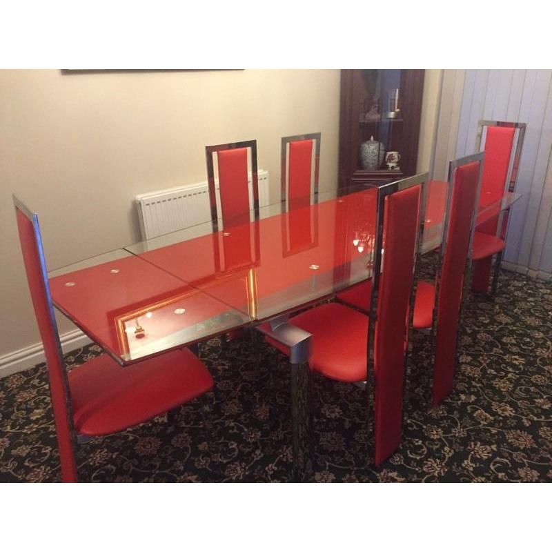 Extendable 8-seater glass dining table and chair set