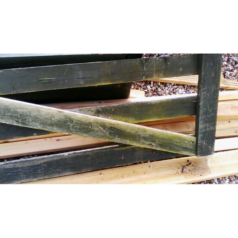 Long wooden gate roughly six ft