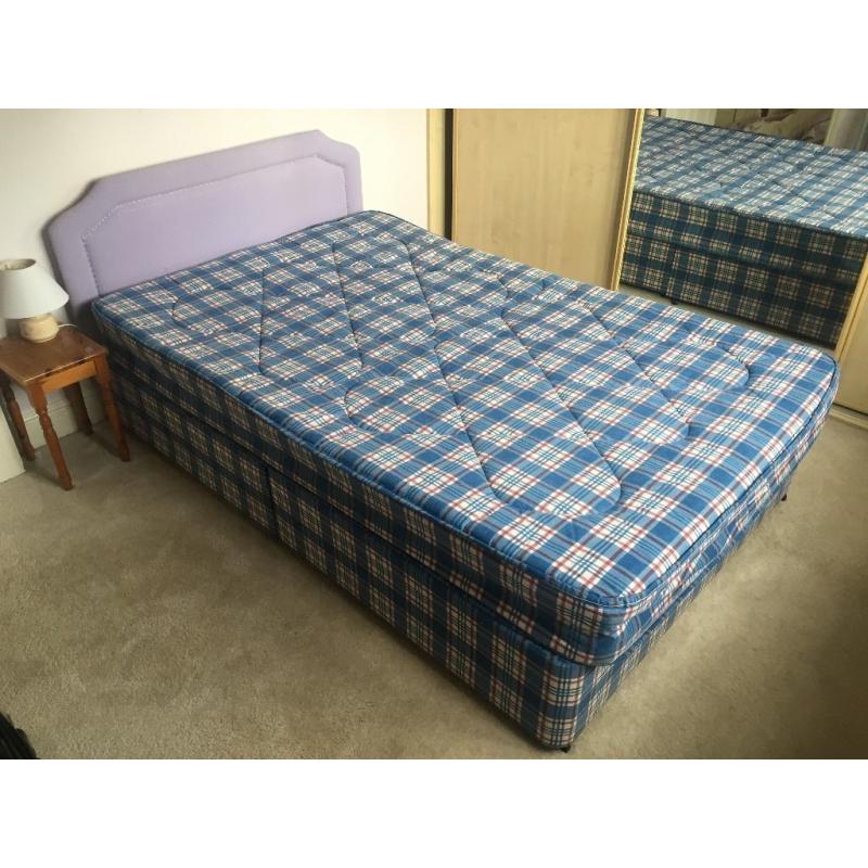 4 foot double, nearly new. Includes mattress and headboard