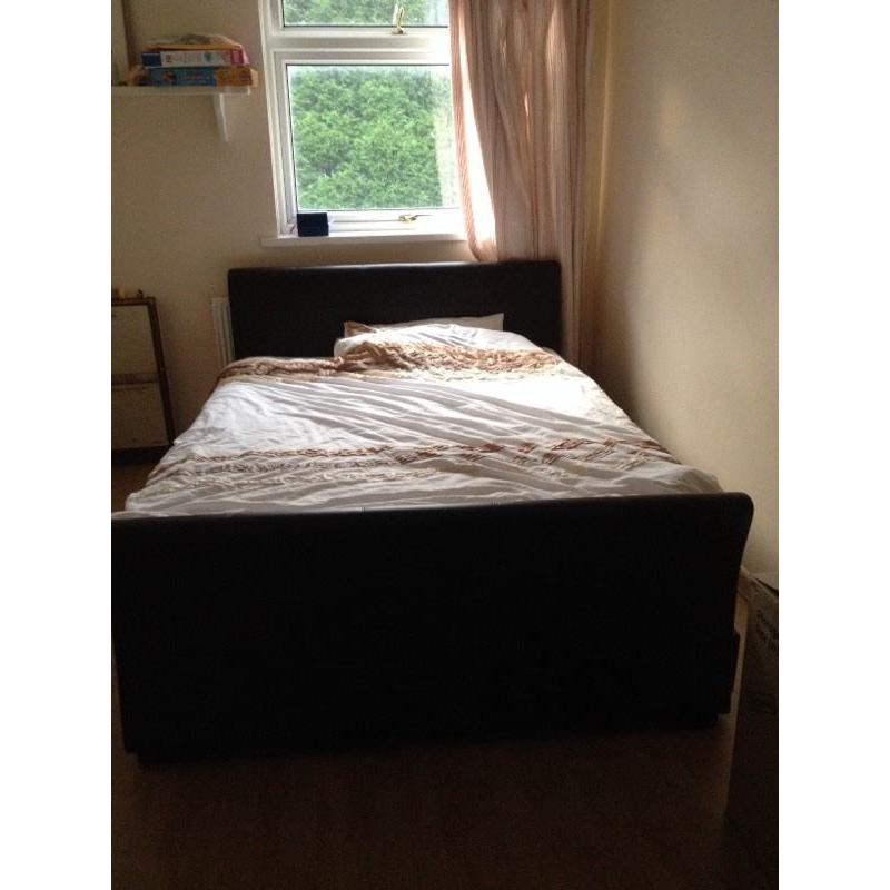 Lovely faux leather king sized bed with four storage drawers