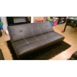 Black faux leather 3 point reclining sofa bed with chrome legs hardly used, Reclines to 3/4 bed.