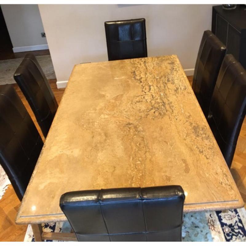Stone dining table and six leather chairs