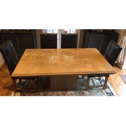 Stone dining table and six leather chairs