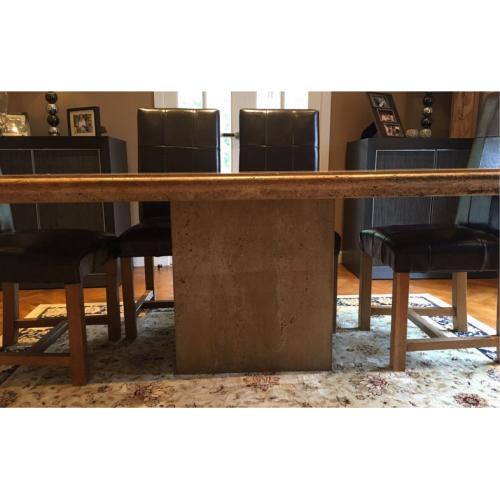 Stone dining table and six leather chairs