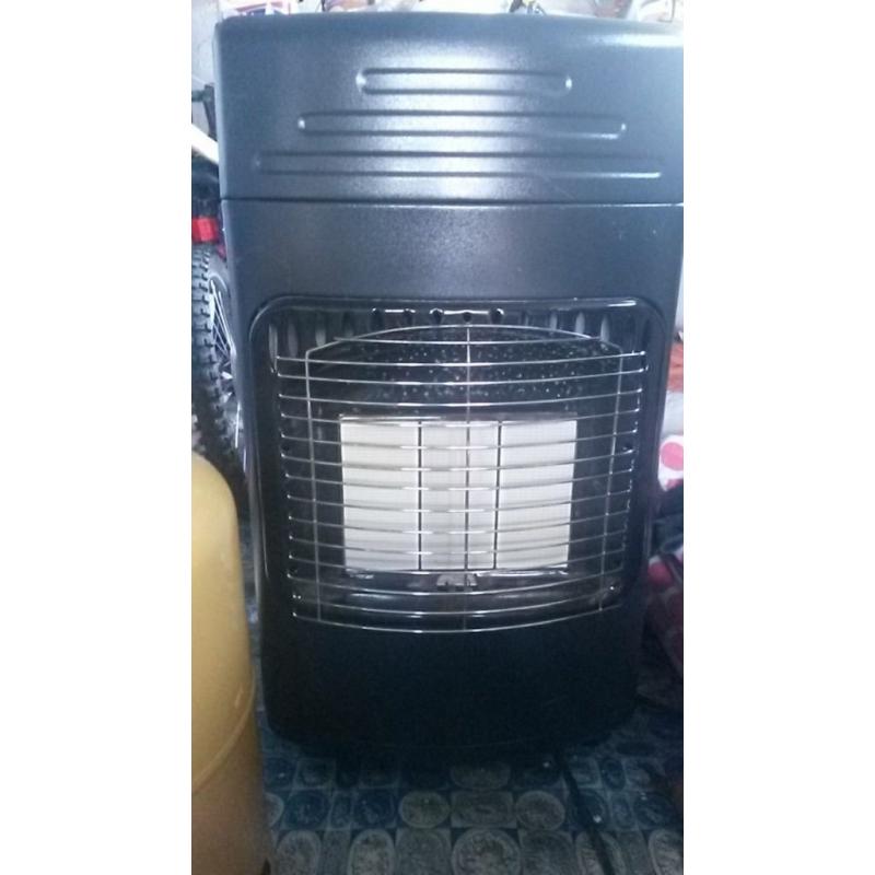 portable Gas heater with gas container included. as new with box.