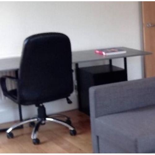Black chest drawer and black office chair