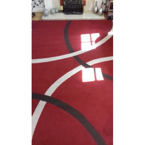 Large red rug. excellent cond.new colour scheme forces sale.230 x 180