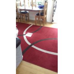 Large red rug. excellent cond.new colour scheme forces sale.230 x 180