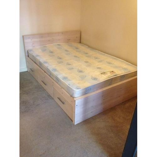 Double wooden bed with mattress