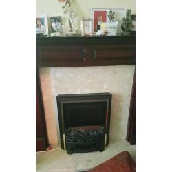 Dark wooden fire surround and electric coal effect fire