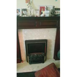 Dark wooden fire surround and electric coal effect fire