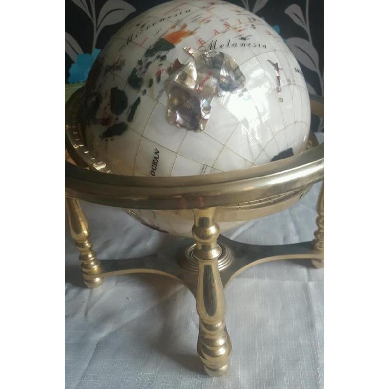 Gemstone globe on a brass stand