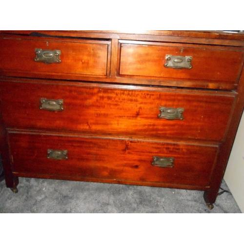 Antique wooden chest of drawers on castors (mahogany?)