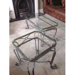 Set of 2 glass-top decorative living room tables.