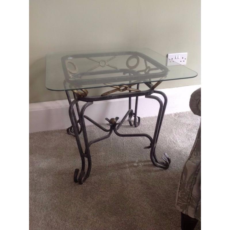Set of 2 glass-top decorative living room tables.