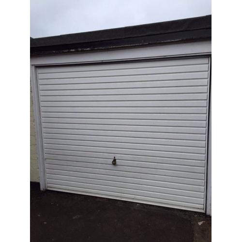 HORMANN White metal up and over garage door.