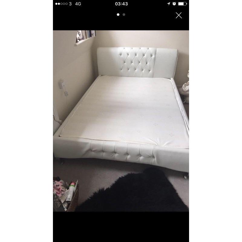 White bed frame with matress