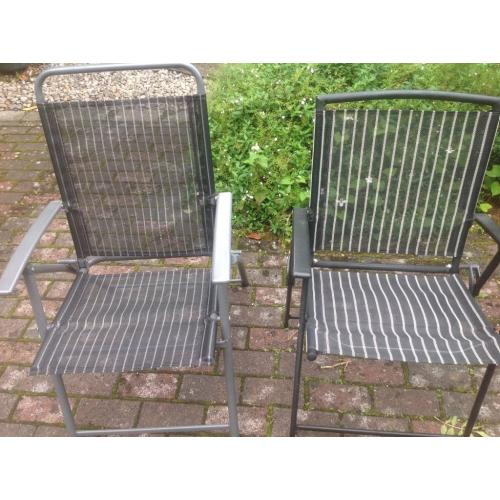 2 black folding garden chairs
