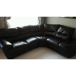 Black leather corner sofa & swivel chair