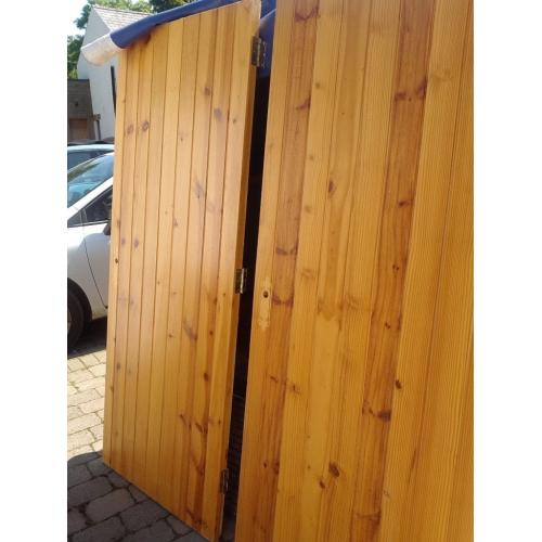 Two solid pine tongue and groove internal doors