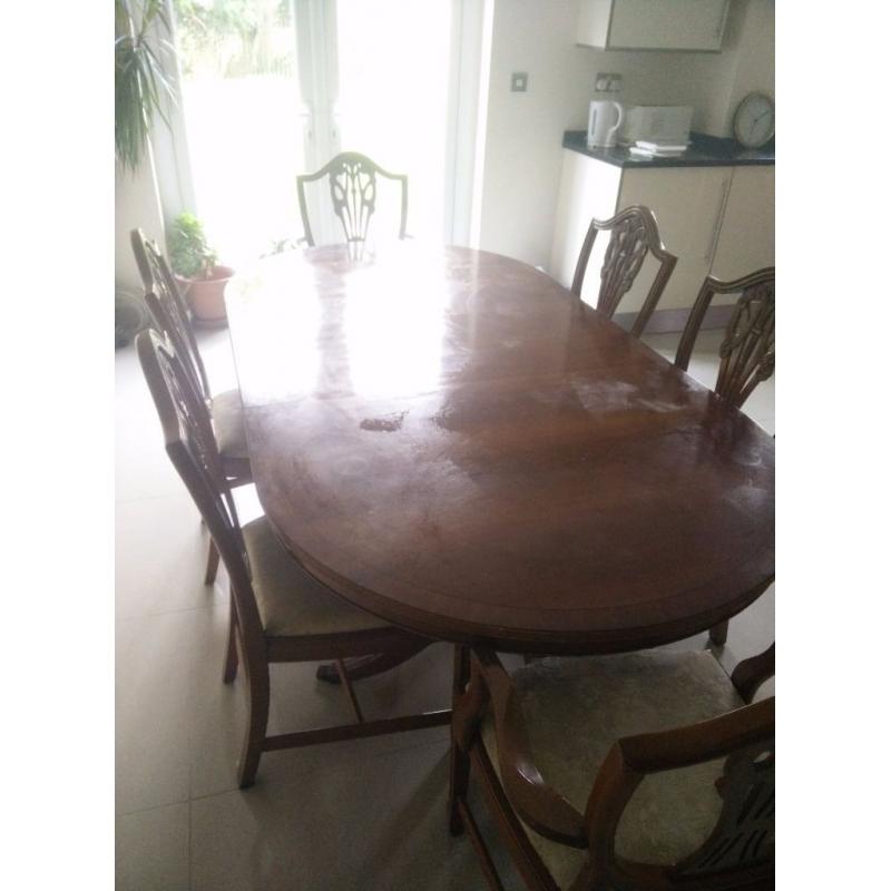 Wooden table with matching chairs