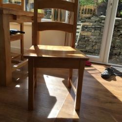 Beech table with drop leaf either end and six chairs