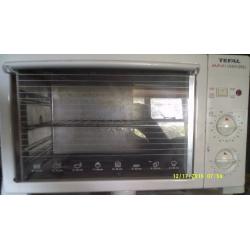 A SMALL WORKTOP OVEN / GRILL IN AS NEAR NEW CONDITION AS IT's POSSIBLE TO BE++