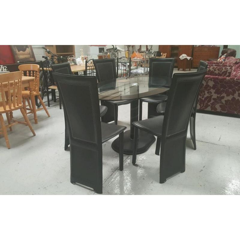 dinning table and 6 chairs in fantastic condition and cost 499 can deliver