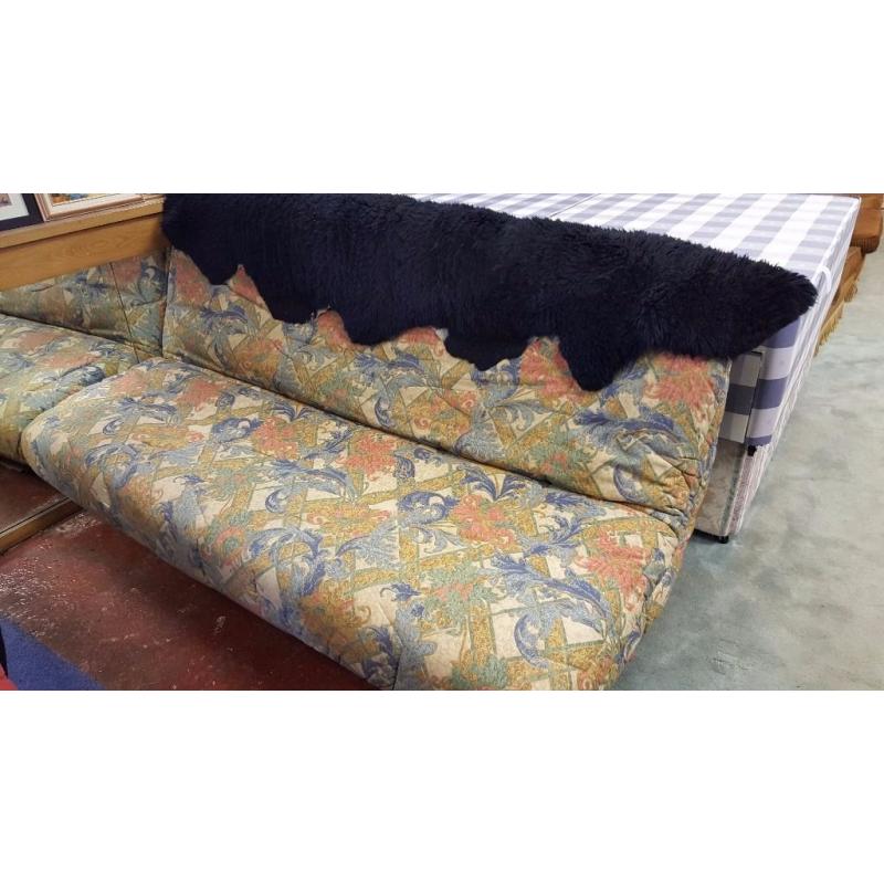 Cream and Green Floral Fabric Sofa Bed with Black Fur Rug in Excellent Condition