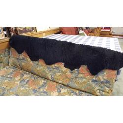 Cream and Green Floral Fabric Sofa Bed with Black Fur Rug in Excellent Condition