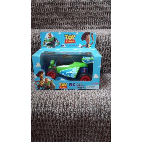 Toy Story RC free wheel buggy. ..STILL IN ORIGINAL BOX.