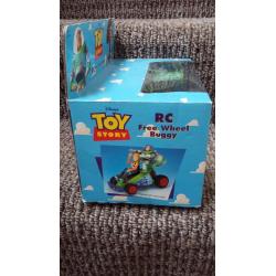 Toy Story RC free wheel buggy. ..STILL IN ORIGINAL BOX.