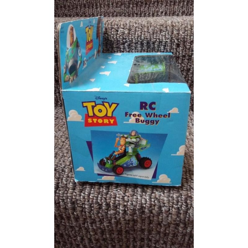 Toy Story RC free wheel buggy. ..STILL IN ORIGINAL BOX.