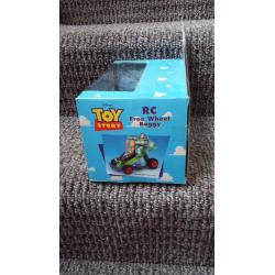 Toy Story RC free wheel buggy. ..STILL IN ORIGINAL BOX.